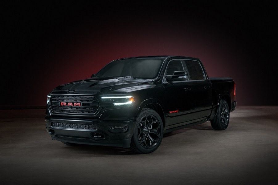 A dark 2022 Ram 1500 parked in shadowy left front angle view
