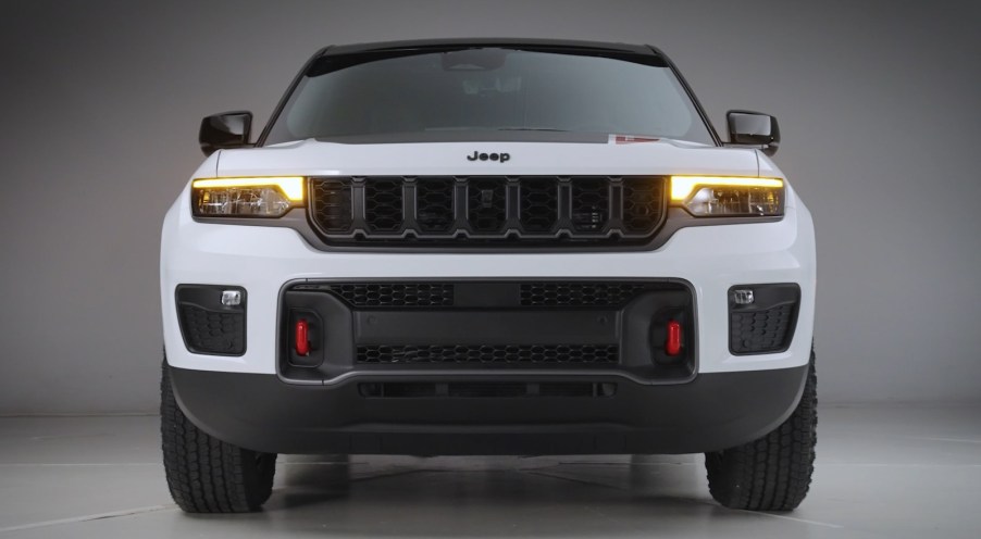 Black grille on a white Jeep Grand Cherokee SUV