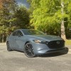 The 2026 Mazda3 Hatch near trees