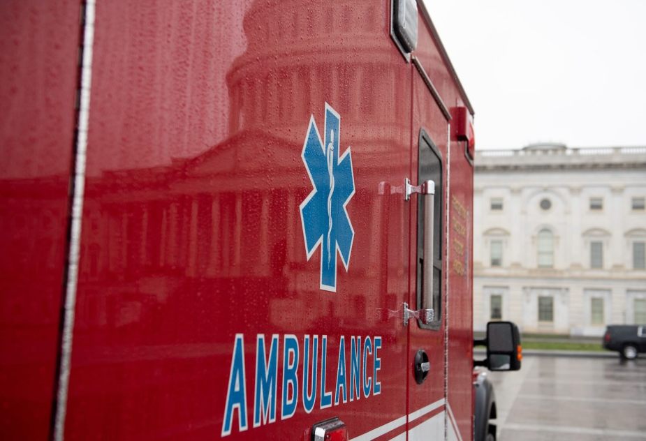 The side of a red ambulance vehicle.