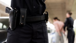 Police officers arresting a woman