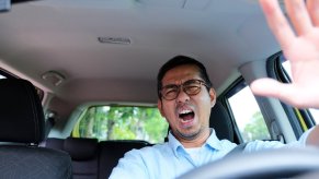 Tesla driver yells at infotainment screen over in-car Tron advertisement.