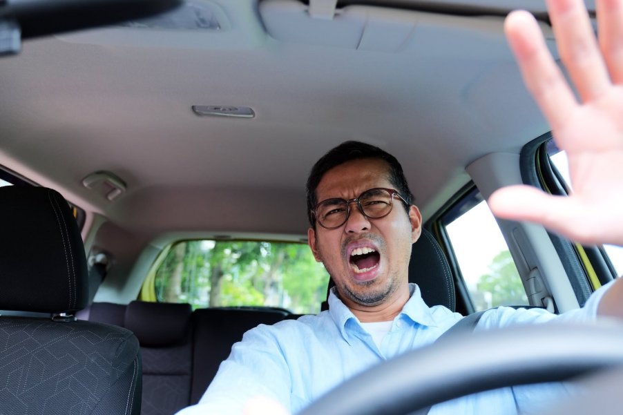 Tesla driver yells at infotainment screen over in-car Tron advertisement.