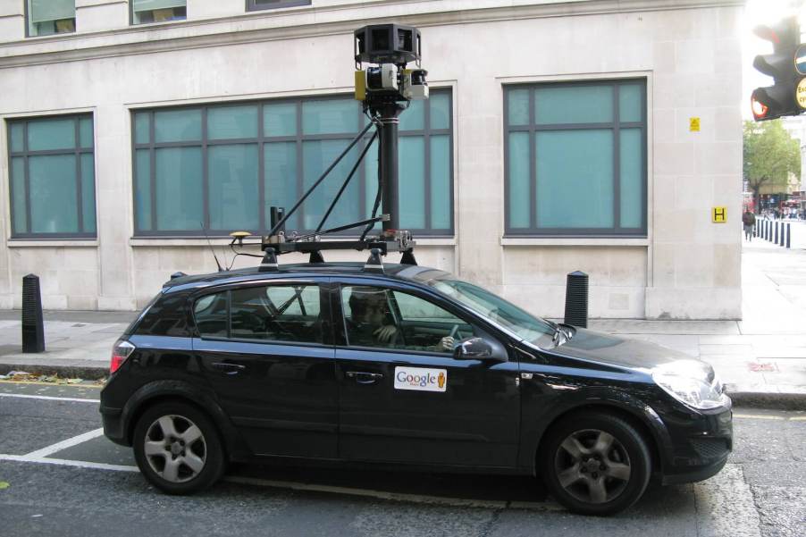 Gray Google Street View hatchback, with a building visible in the background.