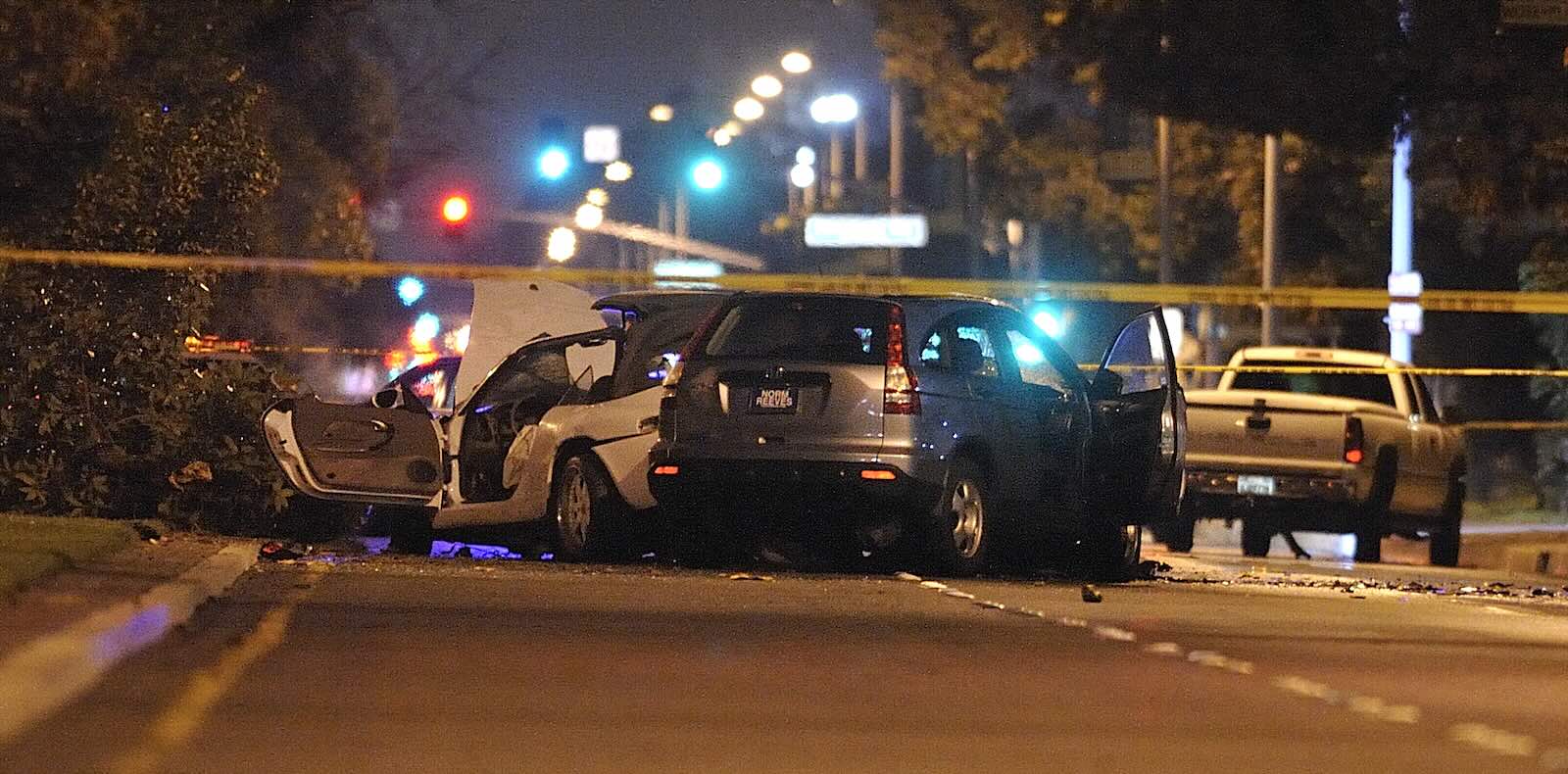Honda CR-V smashed into another car and covered by police tape.