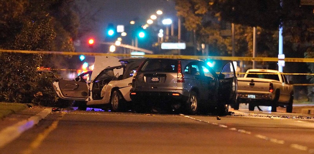 Honda CR-V smashed into another car and covered by police tape.