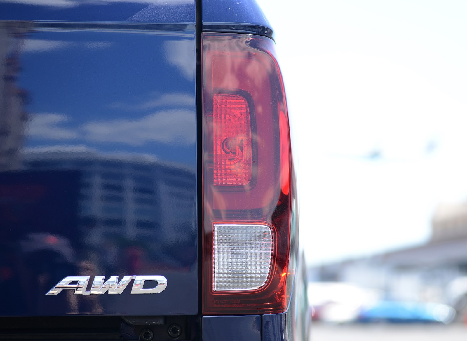 The AWD badge on the rear of a Honda Ridgeline pickup truck