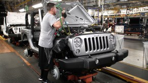 A man assembling a Jeep Wrangler