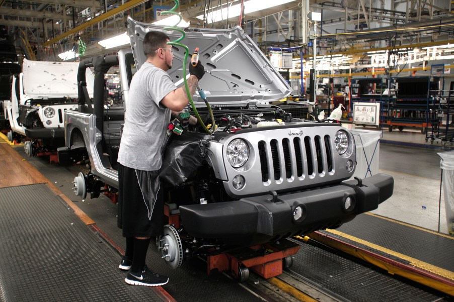 A man assembling a Jeep Wrangler