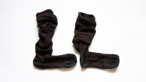 Pair of black socks on a white background.