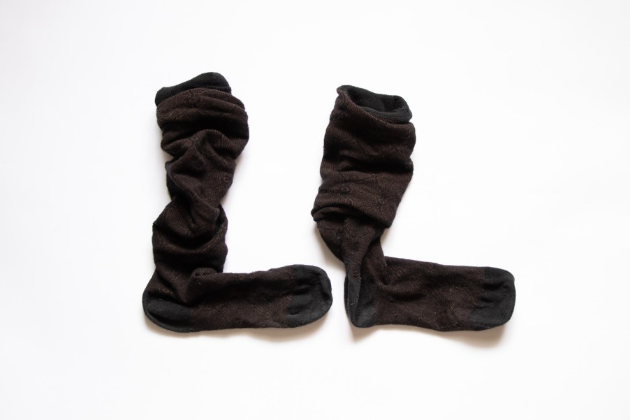Pair of black socks on a white background.