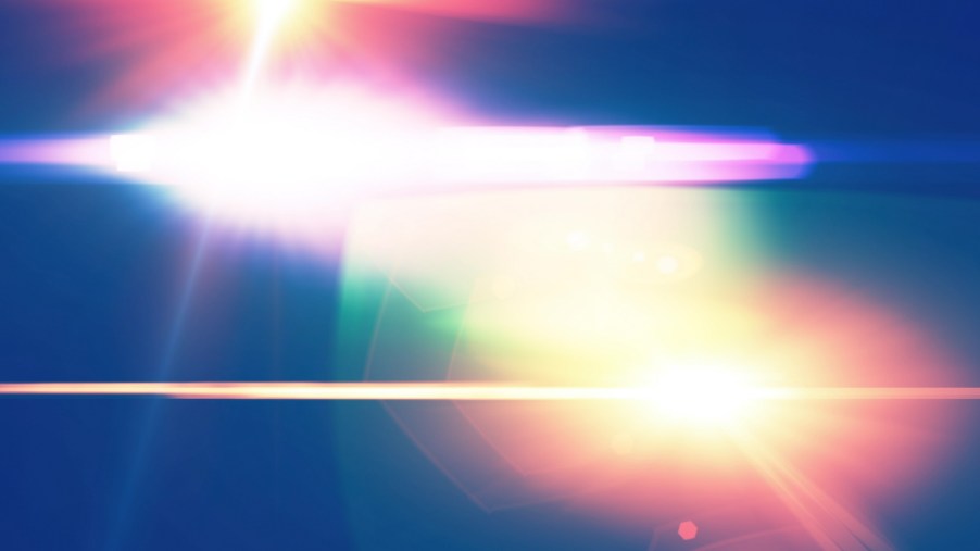 Flashing lights on top of a police cruiser car.