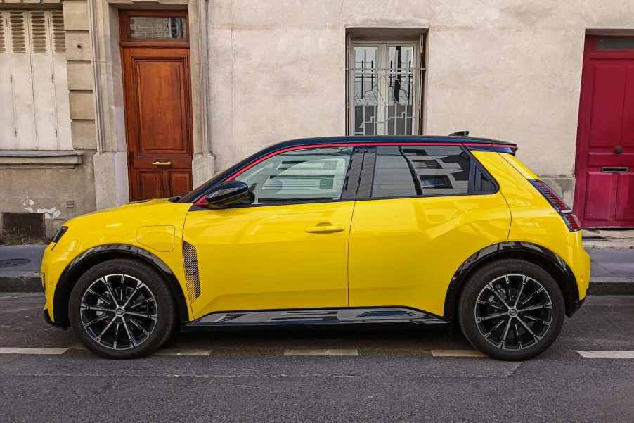 Bright yellow Renault 5 retro EV on the streets of Paris, where France is building a wireless charging road