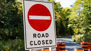 Road closed signs outside a bridge construction site in Detroit.