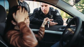 A police officer during a traffic stop with a female driver