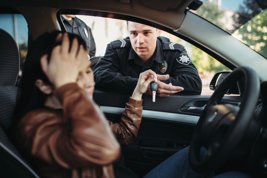 A police officer during a traffic stop with a female driver
