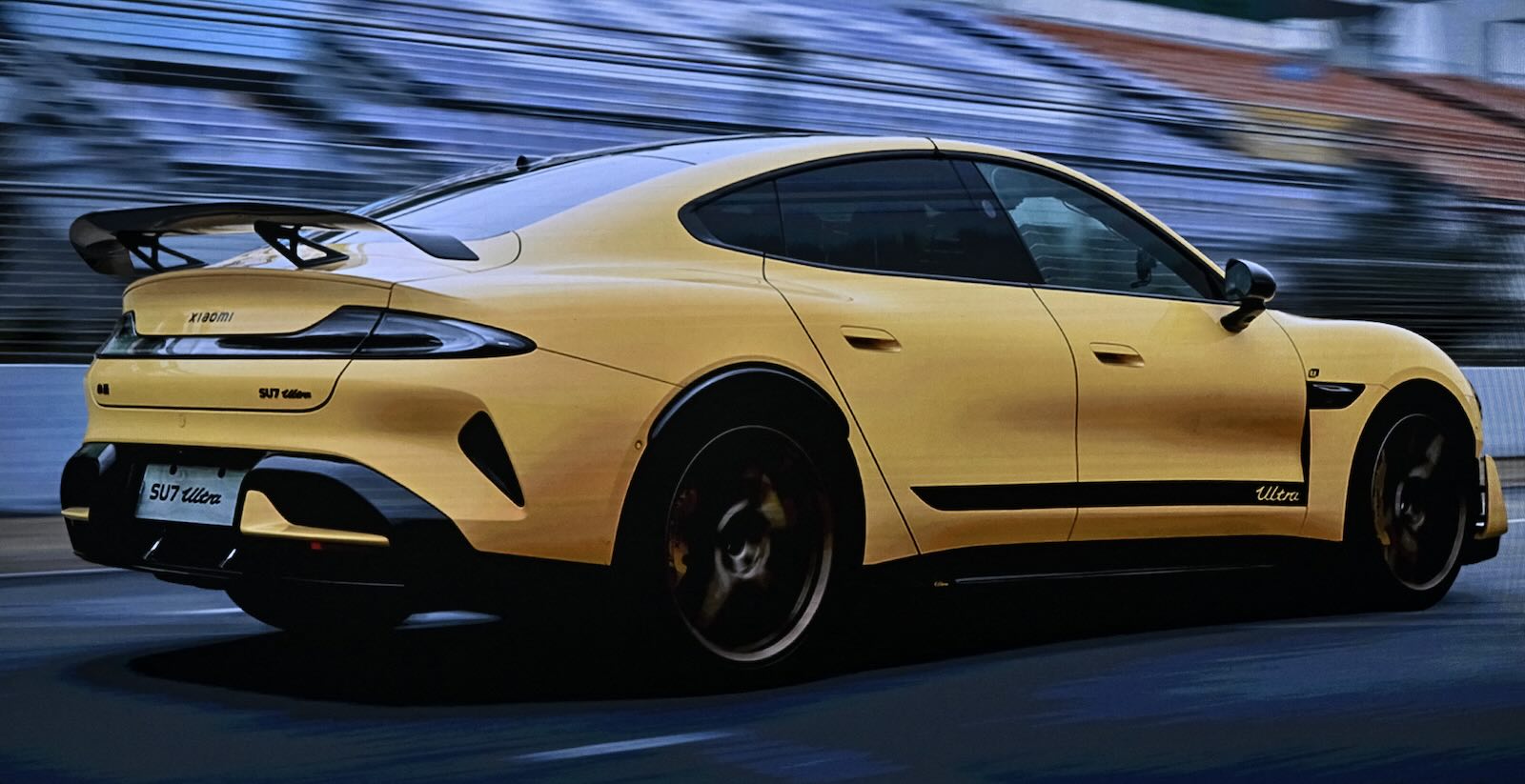 A bright yellow Xiaomi SU7 Ultra sports sedan that took EV records from the Porsche Taycan