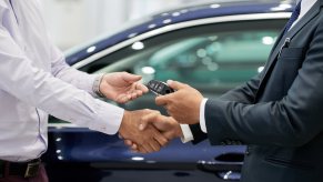 A depiction of a car trade-in at a dealership