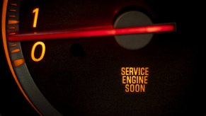 Check engine light on a car dash in very close view