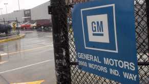 A chain link fence gate entrance outside a GM plant in Georgia