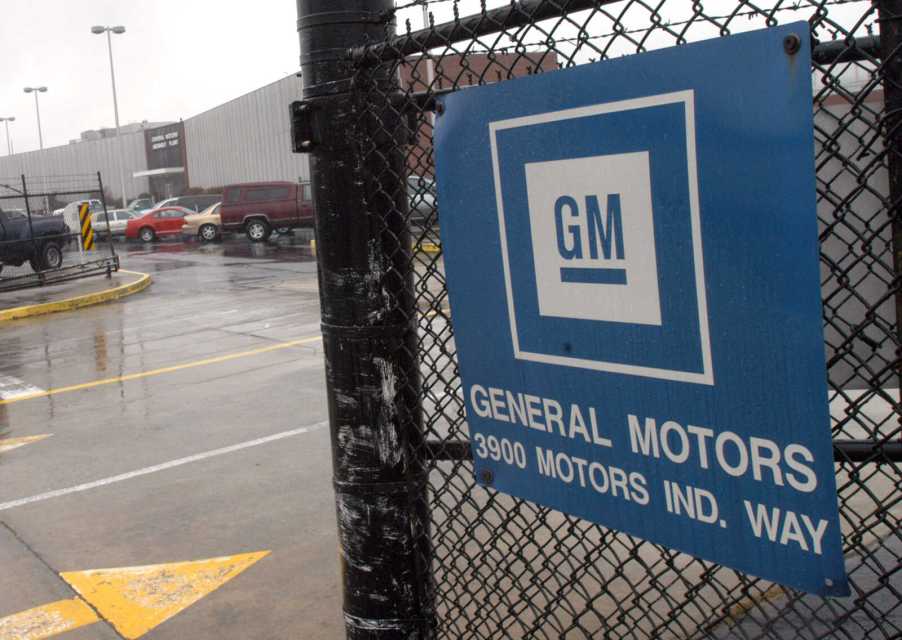 A chain link fence gate entrance outside a GM plant in Georgia