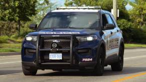 An image shows a black-and-white police SUV.