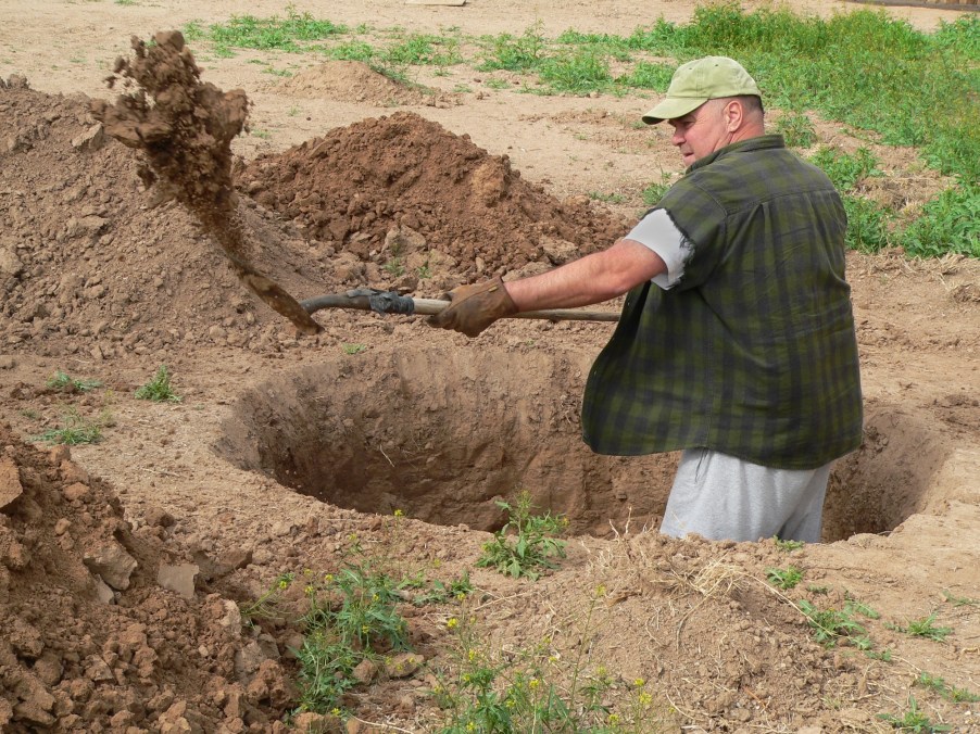 A man digging a hole