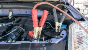 Jumper cables attached to car battery in close view