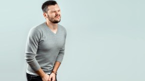 A man acts like he needs to use the bathroom