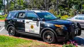 A San Diego police SUV parked in right angle view