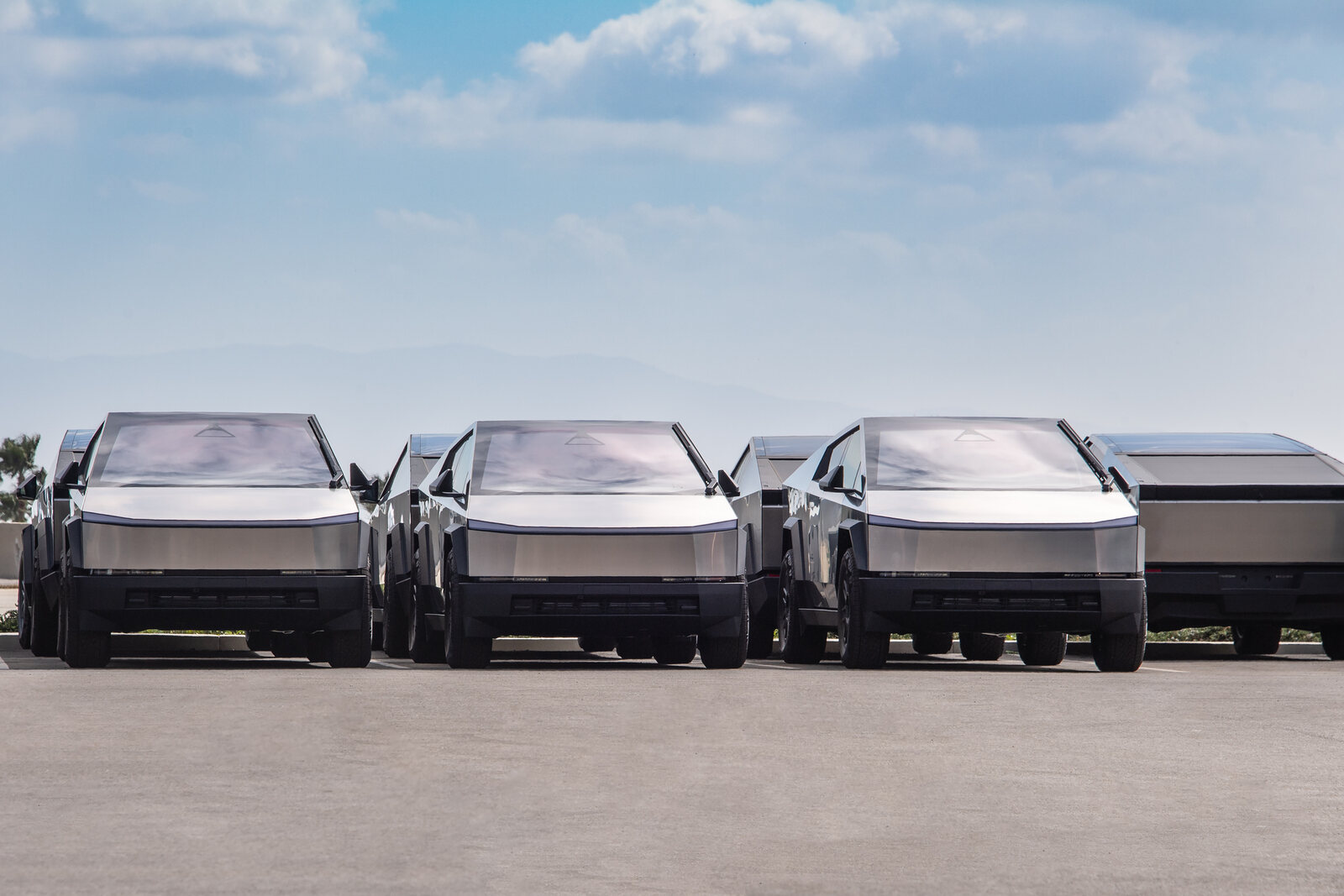 Rows of Tesla Cybertrucks parked in far front view