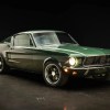 A green 1968 Ford Mustang Fastback 5-Speed parked in right front angle view