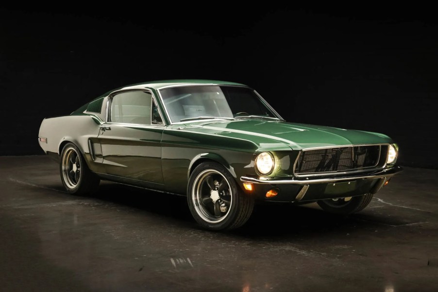 A green 1968 Ford Mustang Fastback 5-Speed parked in right front angle view