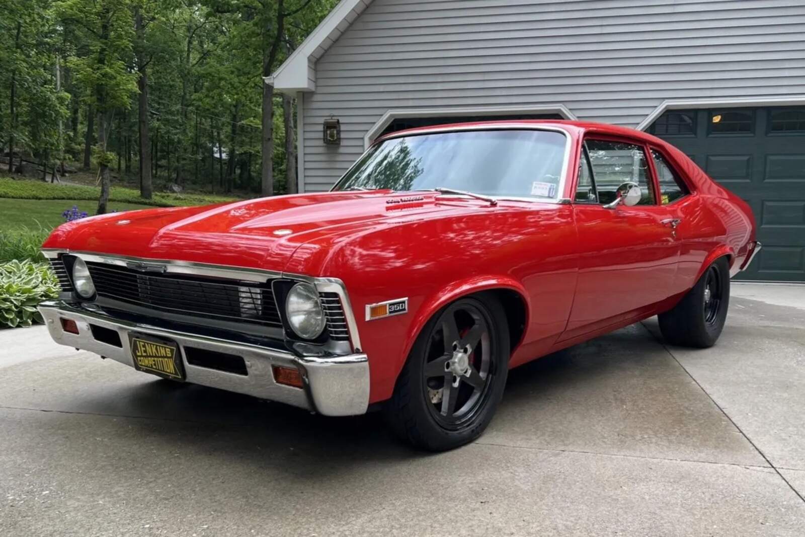 A red 1972 Chevrolet Nova parked in low left front angle view