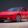 A red 1991 Mitsubishi 3000GT VR-4 parked in left front angle view