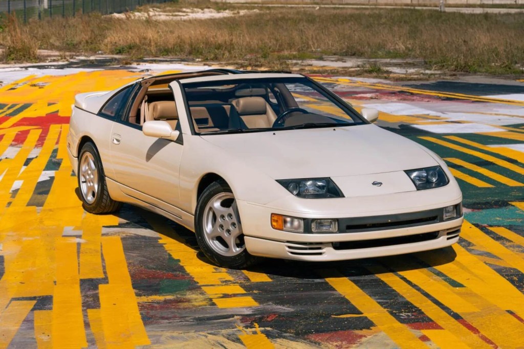 A matte tan 1993 Nissan 300ZX Twin Turbo 5-Speed parked on colorful pavement in right front angle view