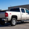 A light metallic 2008 Chevrolet Silverado 2500HD parked in right rear corner view