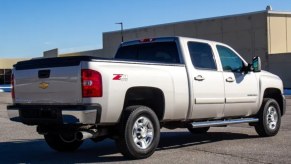 A light metallic 2008 Chevrolet Silverado 2500HD parked in right rear corner view