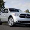 A silver 2013 Dodge Durango parked in low right front angle view
