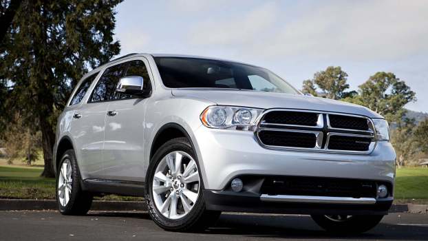 A silver 2013 Dodge Durango parked in low right front angle view