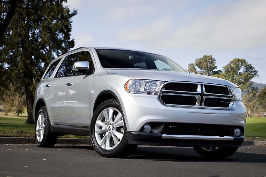 A silver 2013 Dodge Durango parked in low right front angle view