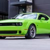 A neon green 2023 Dodge Challenger RT Scat Pack Widebody Swinger Edition 6-Speed parked in low left front angle view