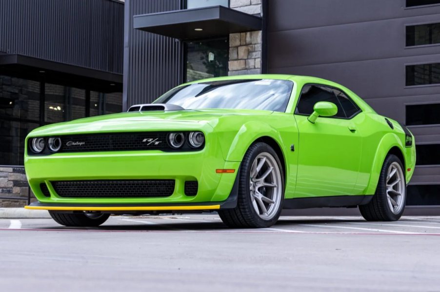 A neon green 2023 Dodge Challenger RT Scat Pack Widebody Swinger Edition 6-Speed parked in low left front angle view