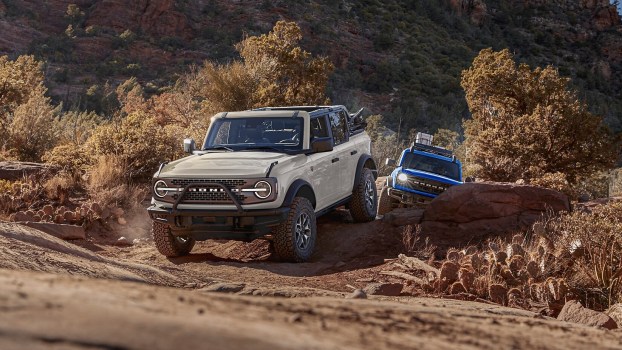 Two 2025 Ford Bronco SUVs off-roading