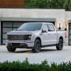 The 2025 Ford F-150 Lightning near a home