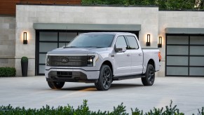 The 2025 Ford F-150 Lightning near a home