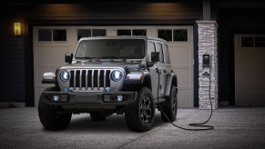 The 2025 Jeep Wrangler 4xe charging at a home