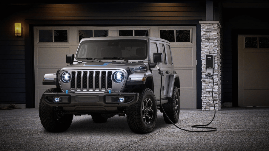 The 2025 Jeep Wrangler 4xe charging at a home
