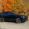 The 2025 Mazda CX-5 near foliage