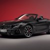 BMW Z4 roadster final edition in front of a red background.